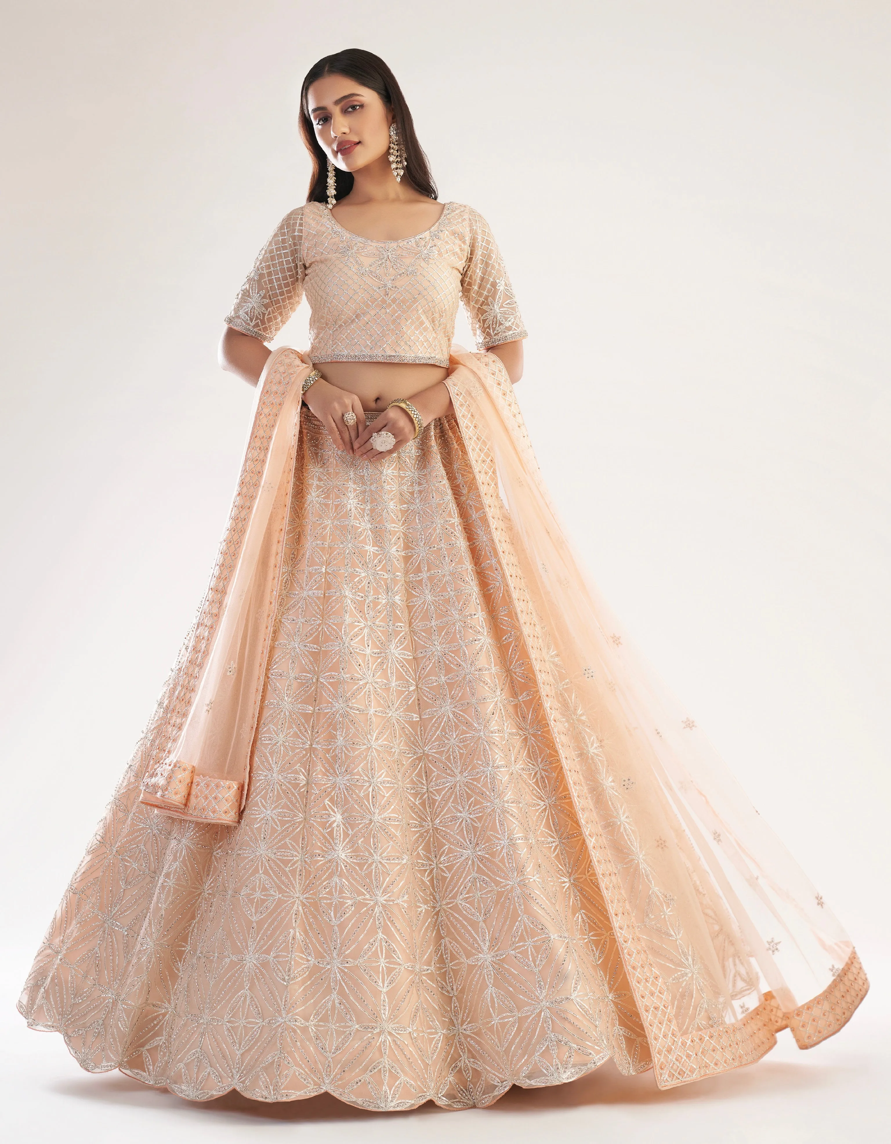 Elegant Peach Net Bridal Lehenga with Ribbon Gota Work and Heavy Zarkan Embellishments