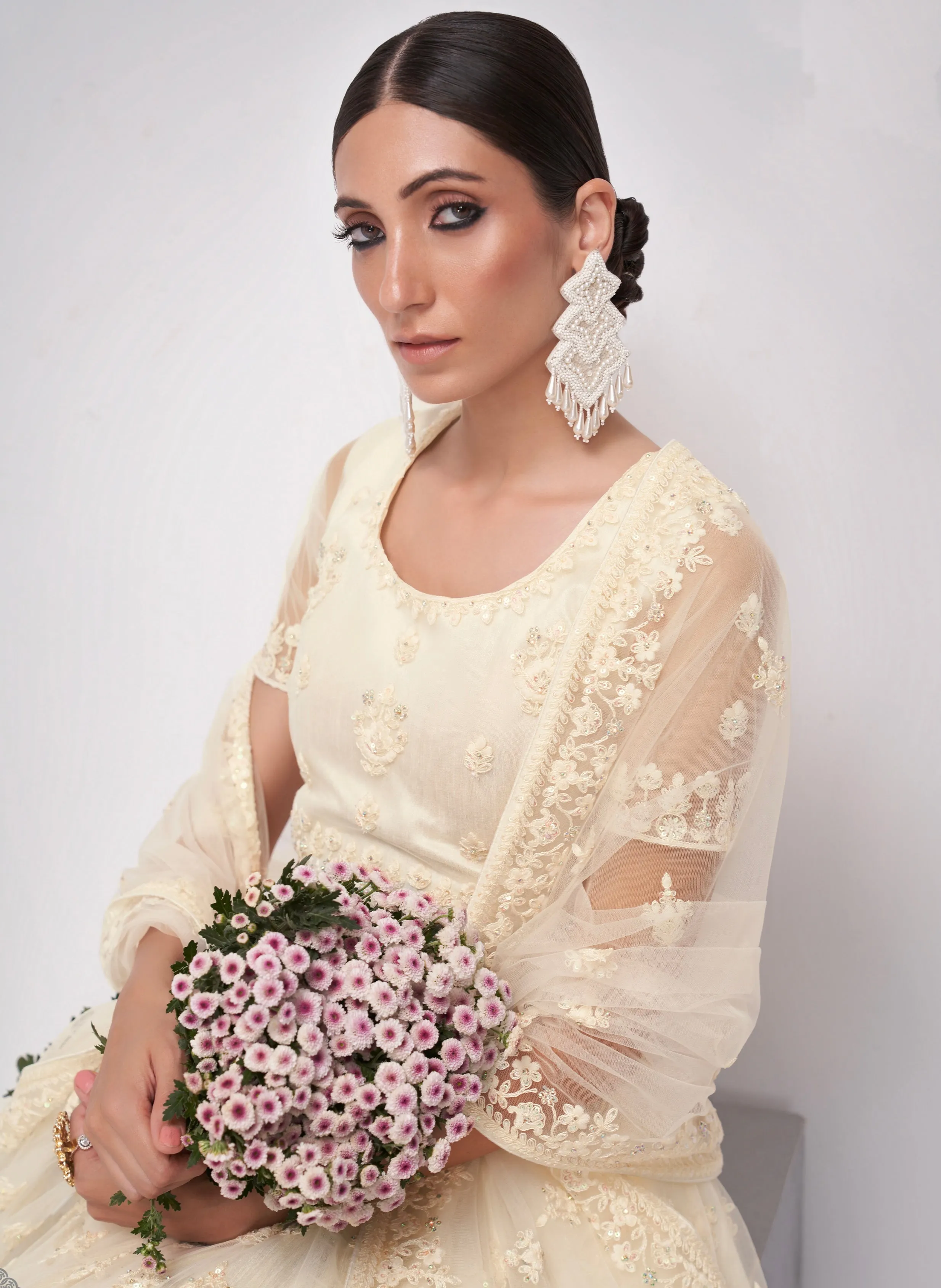 Graceful Off-White Net Lehenga with Cording, Thread & Sequins Embroidery and Stone Embellishments