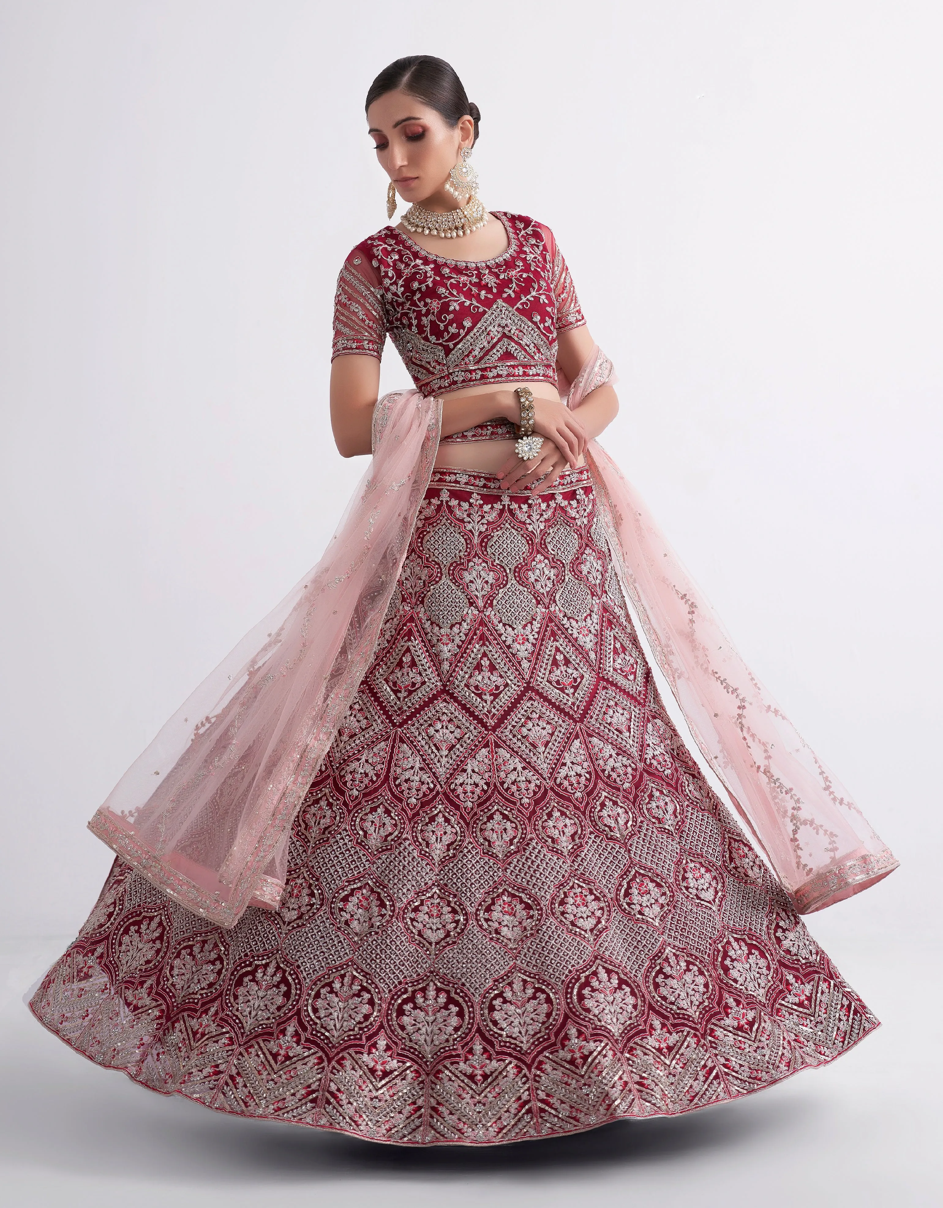 Maroon Net Lehenga Choli with Heavy Stone Work Embellishment